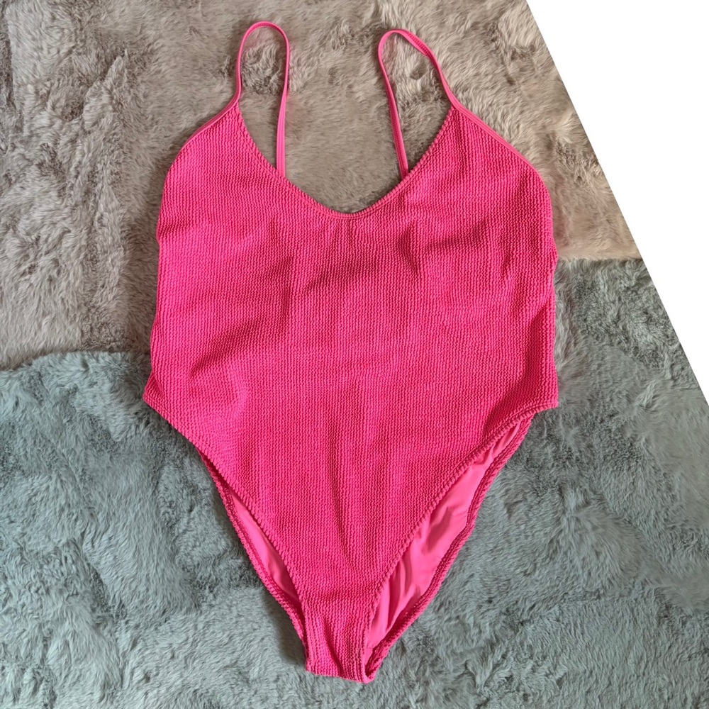Good American always fits one pink one piece swimsuit